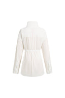Back view of a white belted shirt jacket with long sleeves and stand collar in cotton-blend fabric