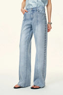 Jeans rectos Calli con panel de cuentas tachonadas en denim de algodón