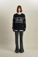 Star Walker Pull Fair Isle noir en laine tricotée avec fil à pompons