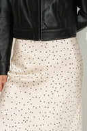 Ivory satin skirt with black polka dots, bias-cut silhouette, shown from the front waist down.