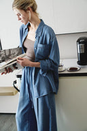 On-model view of relaxed fit sky blue denim shirt with pocket detail and rolled sleeves from Fabrique DENIM collection