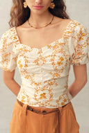 Top à manches bouffantes froncées avec broderie florale Winnie en mélange de lin