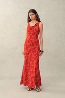 Red sleeveless maxi dress with cowl neckline and tonal floral print, front view on model