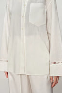 White cotton shirt with openwork trim on cuffs and chest pocket, front view, from Blouses & Shirts collection.