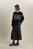 Star Walker Pull Fair Isle noir en laine tricotée avec fil à pompons