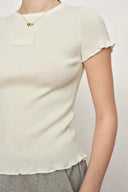 T-shirt sculpté blanc Linnea à volants en coton et maille de laine