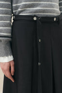 Black belted pleated midi skirt in wool blend with metal buckle details