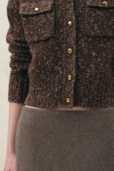 Brown cropped cardigan with gold tone buttons, patch pockets, and textured wool blend knit detail