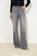 Grey crystal embellished wide leg jeans with subtle fading and a straight silhouette