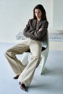 Womens khaki washed denim jeans with an elongated straight leg and curved side pockets
