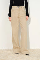 Warm khaki washed denim women's jeans with curved pockets and elongated straight legs