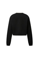 Black lyocell-wool blend knit cardigan with pearl embellishments along neckline, back view on white background.