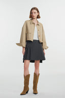 Earth tone cotton-blend jacket with button front and stitched seam detail, front view on model