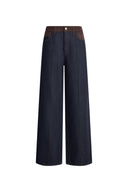Dark indigo women's jeans with a warm tan faux suede waistband and relaxed straight legs