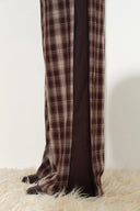 Plaid wide leg pants with dark contrast panels and tailored drape
