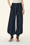Dark washed denim barrel-leg jeans with an elastic waist and gathered hems