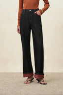Womens black straight leg jeans with plaid fleece lining, folded cuffs and contrast topstitching