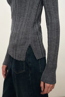Fitted grey Merino wool knit top with irregular ribbing and side slits