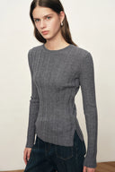 Gray fitted wool knit top with irregular ribbing and side slits