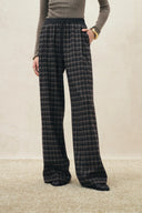 Plaid flannel wide leg pants with a drawstring waist, styled with a fitted top