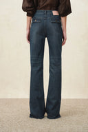Womens dark washed flare jeans with flap pockets and split hems