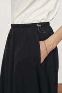Cathy Black Twisted-Seam Bubble Midi Skirt in Lightweigt Blend