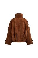 Back view of a caramel vegan suede jacket with batwing sleeves and sculptural pleating