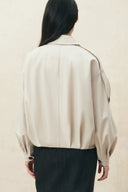 Ivory ruched hem lightweight jacket with a softly rounded silhouette and gathered sleeves