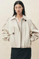 Ivory lightweight jacket with ruched sleeves zip front and flap pockets