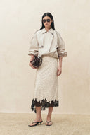 Ivory ruched hem lightweight jacket styled with a lace trimmed midi skirt