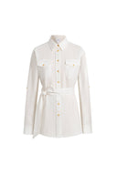 White belted safari blouse in linen-blend fabric with roll tab sleeves and front flap pockets, front view.