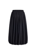 Black elasticated bubble midi skirt with gathered fullness and a sculptural rounded silhouette