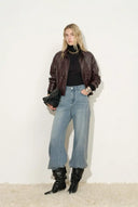 Chaqueta corta estilo gabardina Gia en cuero sintético
