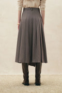 Houndstooth pleated wrap midi skirt with a V cut waistband and asymmetric pleats