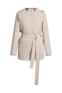 Beige cropped trench coat with long sleeves, waist tie belt and shoulder button detail