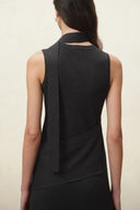 Black silk cotton blend knit dress with fitted silhouette, scarf tie and asymmetric layered skirt