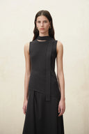 Black sleeveless knit dress with asymmetric layered panels and a long flowing skirt