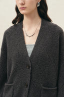Deep grey wool alpaca blend cardigan with textured openwork knit, button front and patch pockets