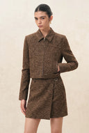Brown wool blend jacket with curved tailored sleeves and hidden zip on model