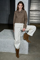 Brown flecked wool blend jacket with curved tailored sleeves styled with white pants and brown boots
