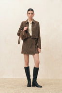 Brown wool blend womens jacket with curved sleeves and hidden zip, styled with a skirt and knee high boots