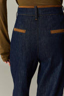 High waisted wide leg women's jeans in dark cotton denim with tan suede waistband and pocket trim