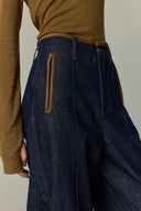 Raw denim high waisted wide leg jeans with contrast brown trim and zip pocket detail