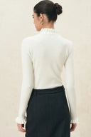Moonlight white fitted wool blend turtleneck top with ruffle collar and cuffs
