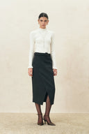 Moonlight white wool blend turtleneck top with ruffle trim styled with a black wrap midi skirt