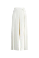 White wide leg culottes in lightweight suiting with a pleated A line silhouette and waist detail