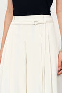 Cream high waisted wide leg culottes with a belted waistband and flowing pleats