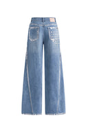 Light wash cotton denim jeans with silver edged seams and star embellishment