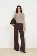 Brown wide leg womens jeans with a self fabric belt and utility patch pockets