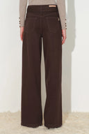 Brown cotton denim wide leg jeans with a belted waist and shield shaped patch pockets
